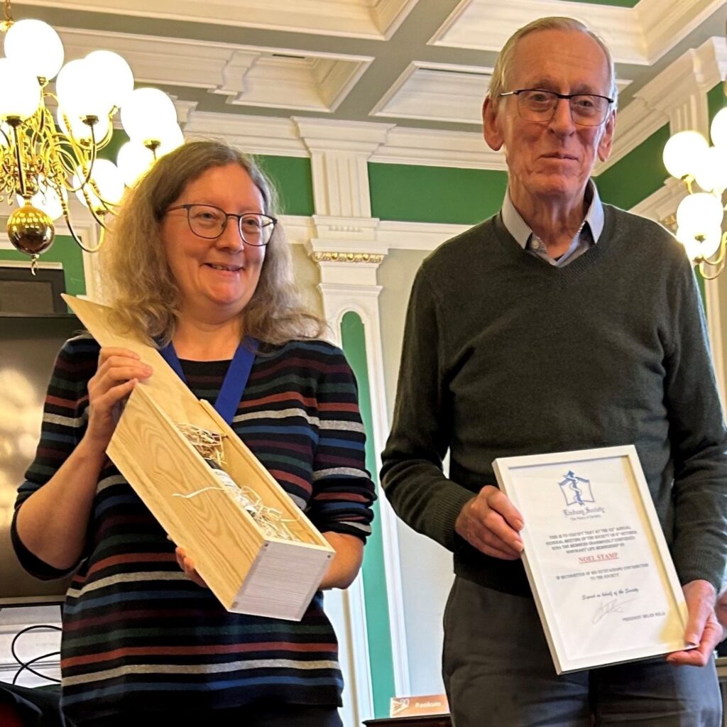 Noel Stamp being presented with his life membership by Lindsay Society President, Helen Nield